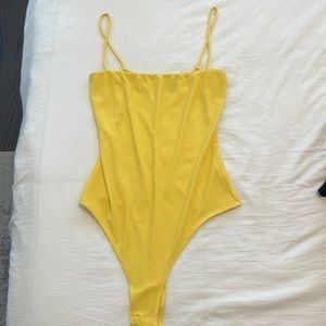 Yellow body suit